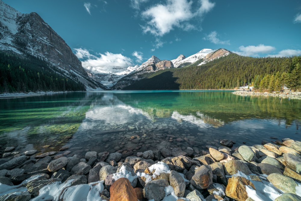 breathtaking-shot-beautiful-stones-turquoise-water-lake-hills-background.jpg
