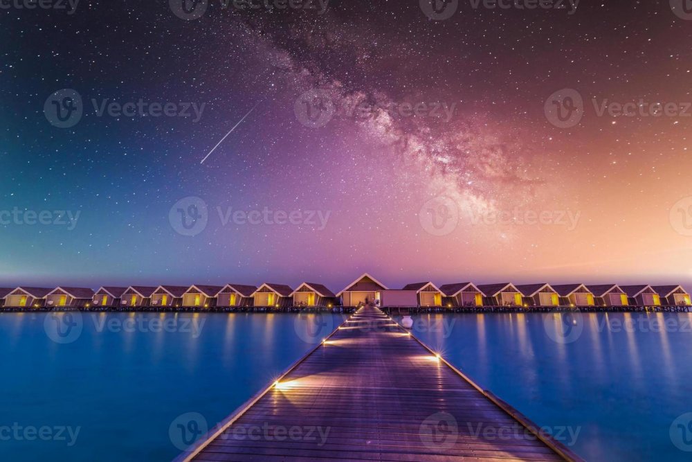 6933122-bungalow-acqua-e-ville-di-notte-paesaggio-tropicale-maldive-isole-ville-di-lusso-di-notte-con-cielo-via-lattea-e-molo-illuminato-a-led-vacanze-estive-sfondo-esotico-fantastico-natura-foto.jpg